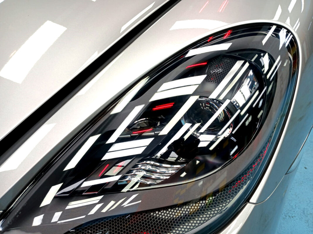 The 718 Boxster's coated paintwork holding clean reflections.