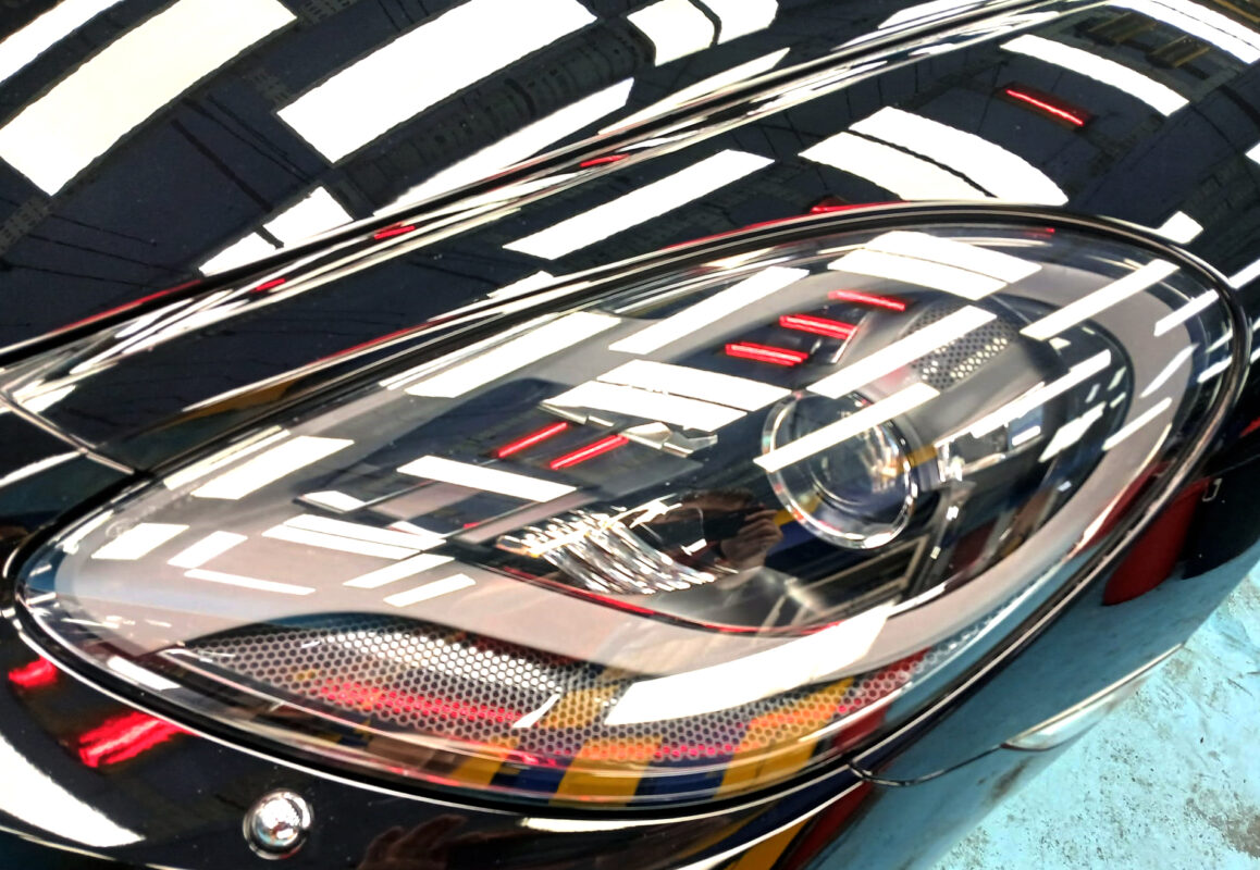 The 718 Cayman's coated paintwork holding clean reflections.