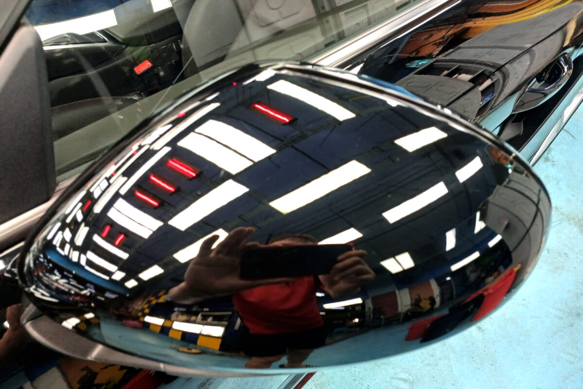 Rear quarter of the Porsche 718 Cayman, glossy and protected.