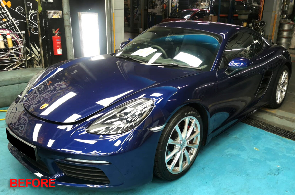 Porsche 718 Cayman after its full respray at Revol Carz, fresh gloss finish.