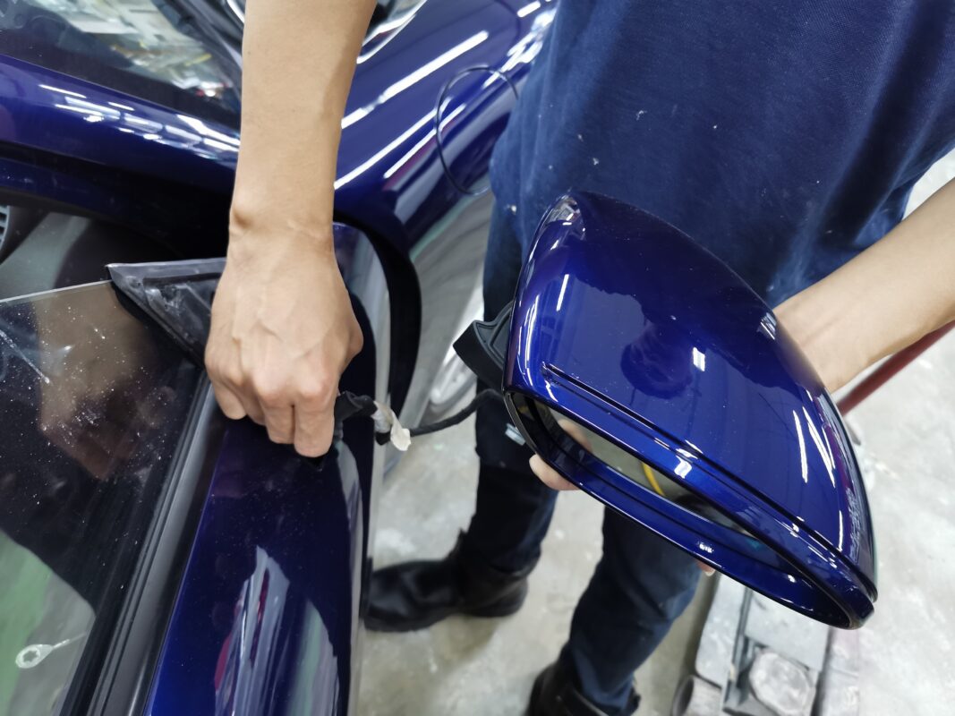 Reassembly in progress on the Porsche 718 Cayman, trim and parts going back on.