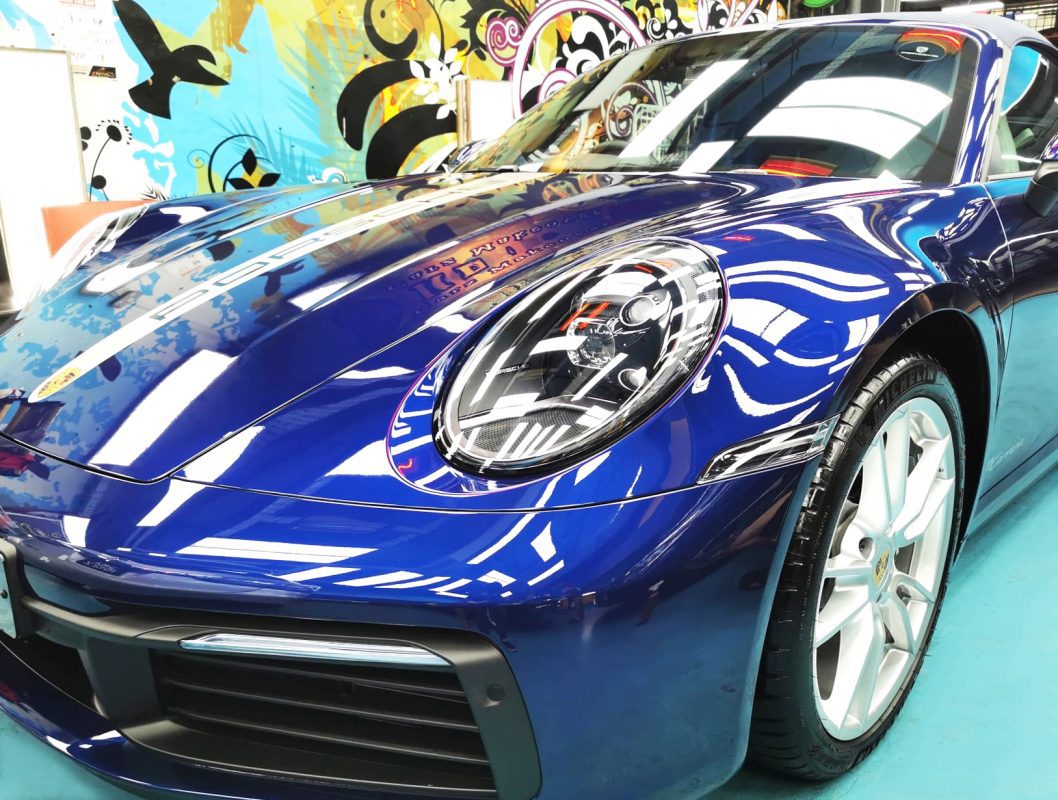 The Porsche 911 Carrera Cabriolet from a side angle after the ceramic coating.