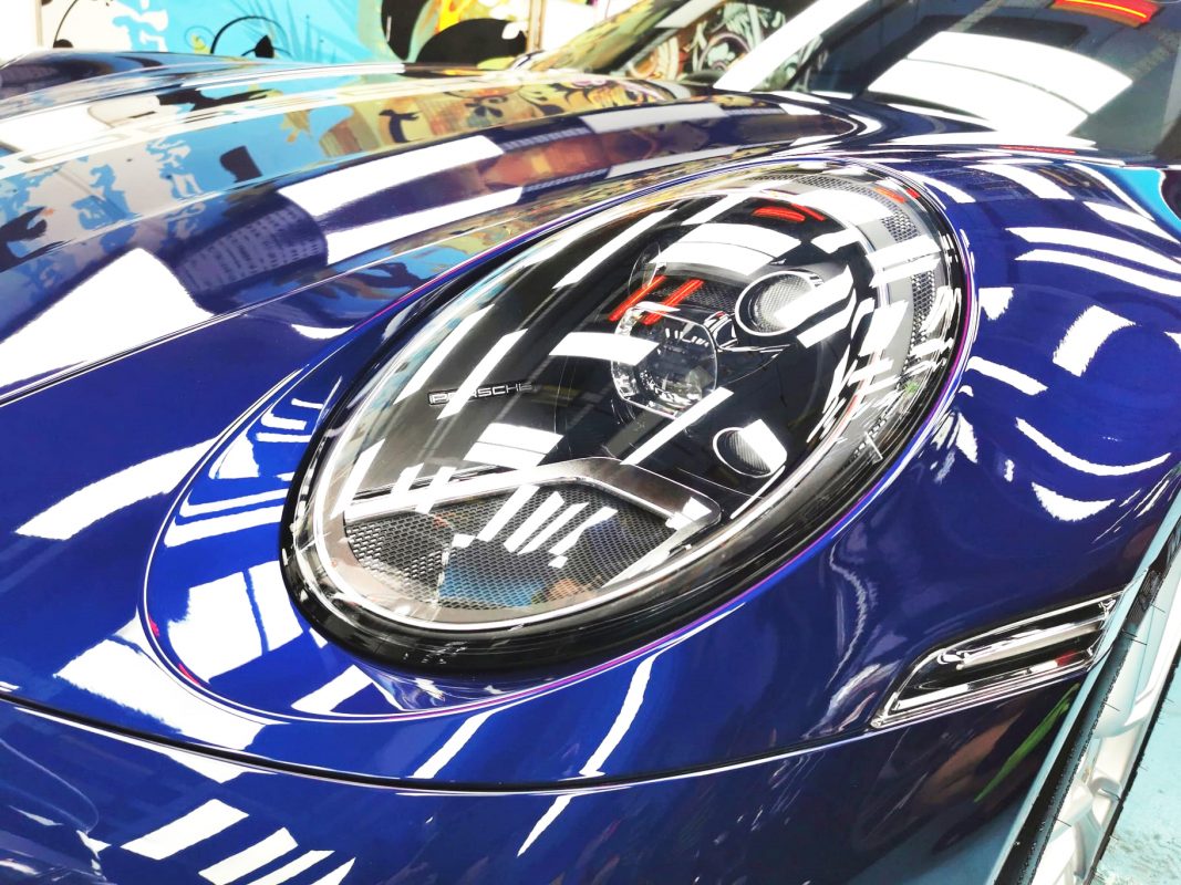 The 911's coated paintwork showing clean reflections.