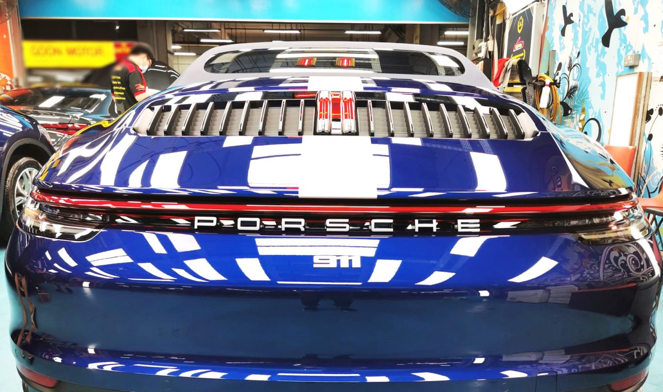 Rear quarter of the 911, glossy and protected.