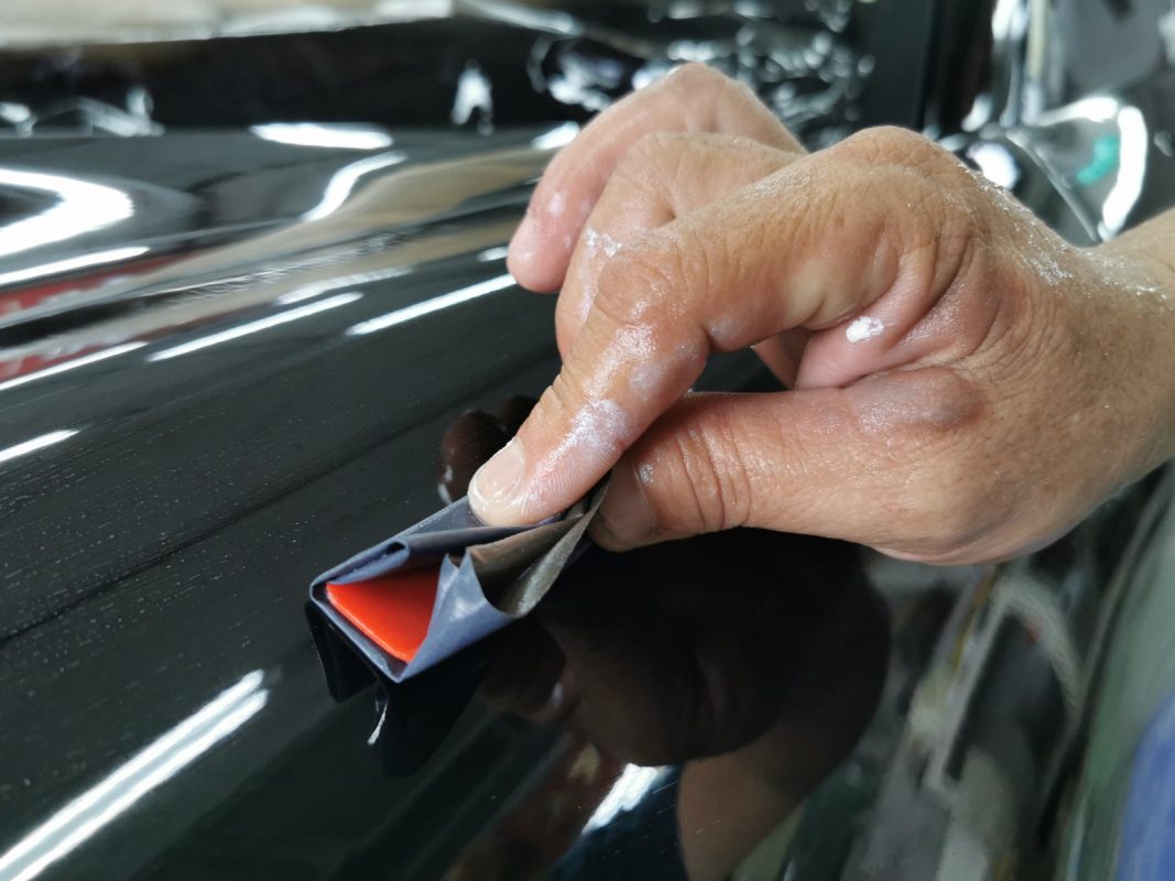The 911 Carrera after spraying, being sanded for an even surface.