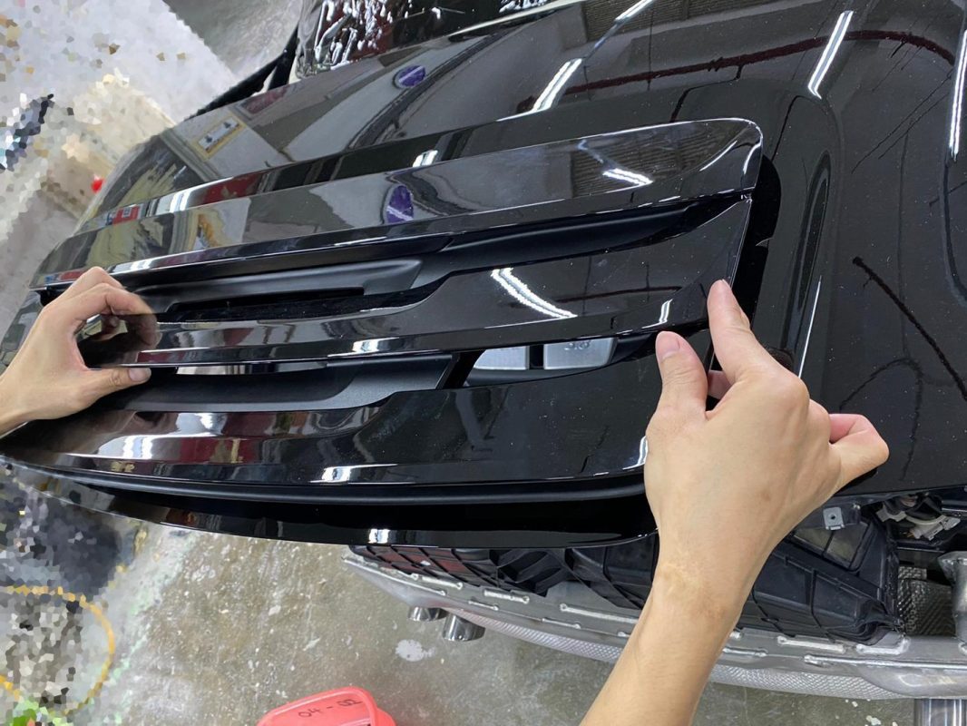 Polishing the new paint on the 911 Carrera to bring up the shine.
