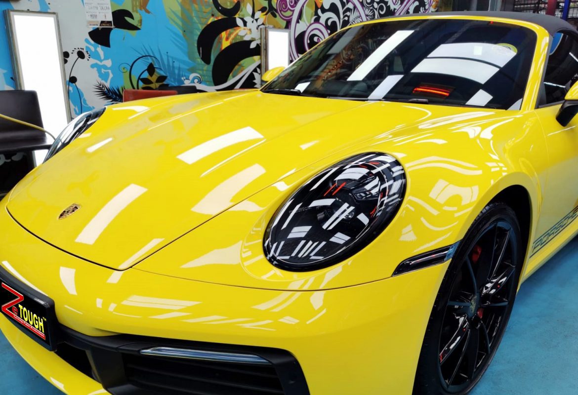 The Porsche 911 Carrera S Cabriolet from a side angle after the titanium coating.