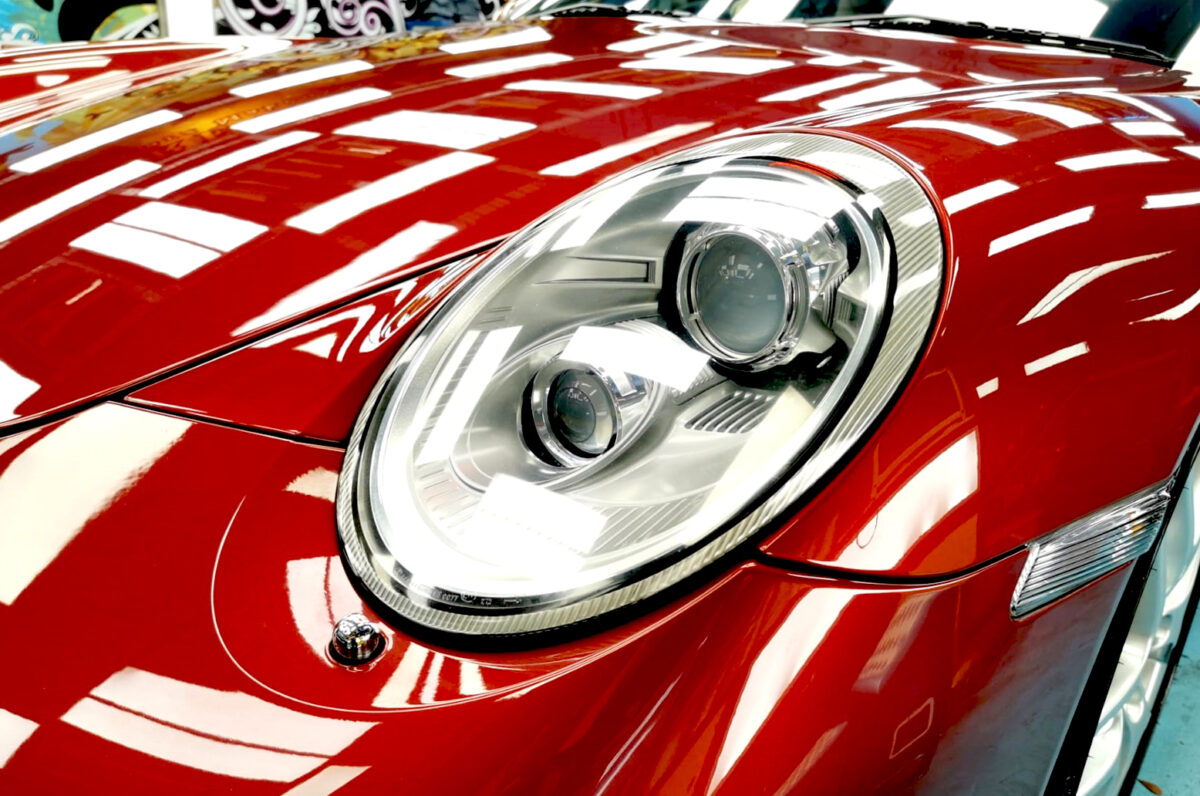 The 911 Carrera S's coated paintwork holding clean reflections.