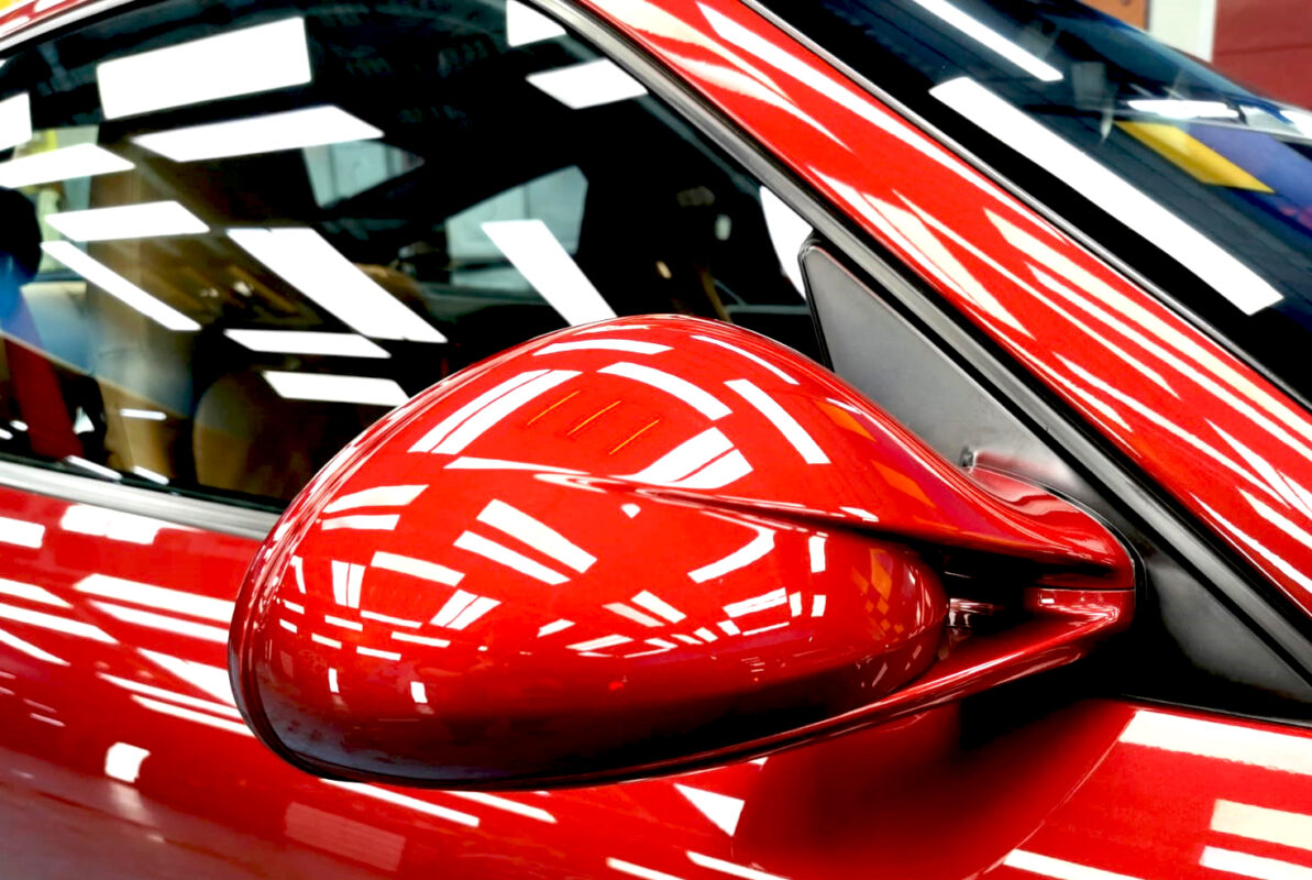 Rear quarter of the Porsche 911 Carrera S, glossy and protected.