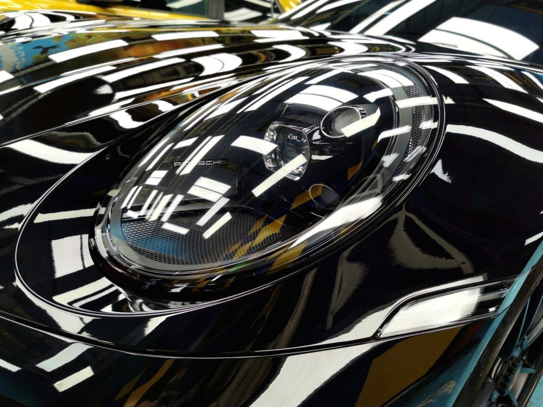 The 911 Carrera's coated paintwork holding clean reflections.