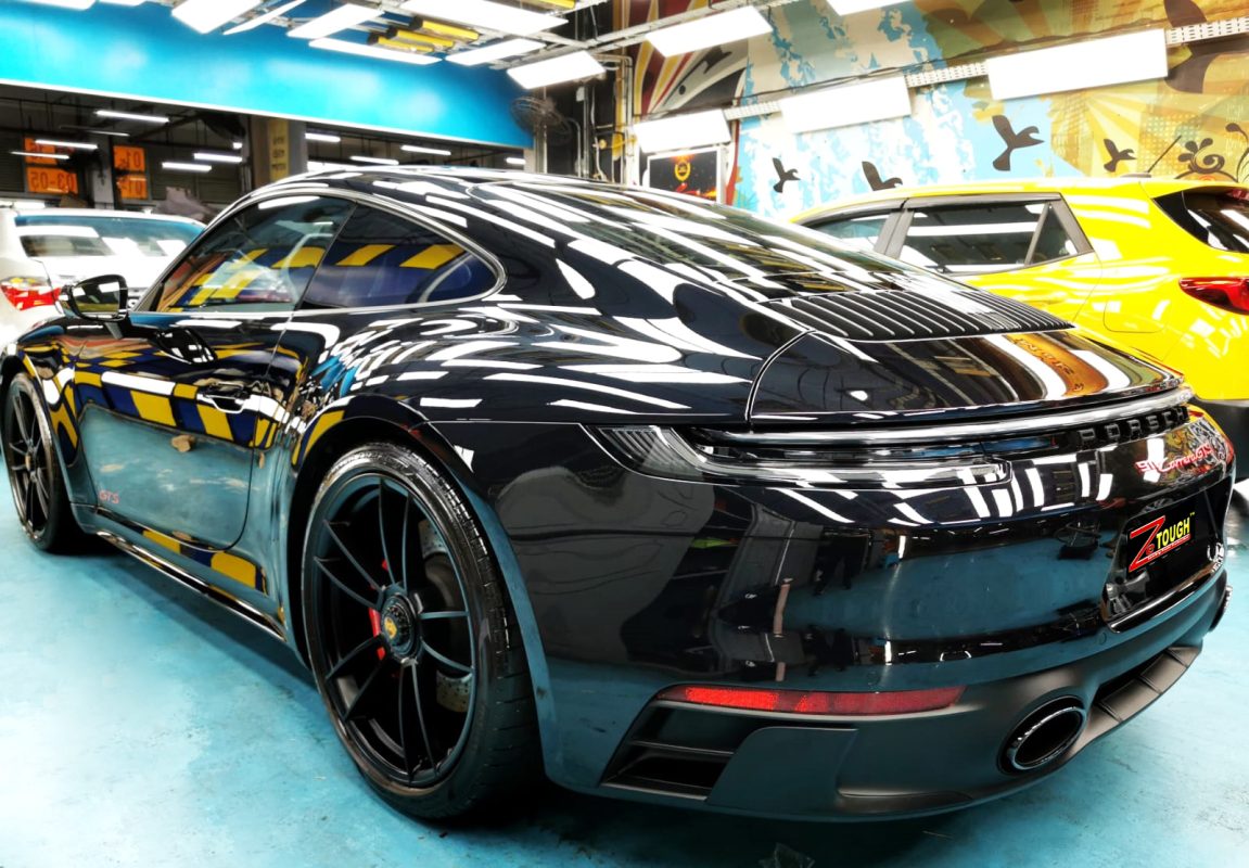 The Porsche 911 Carrera parked in the workshop after coating.
