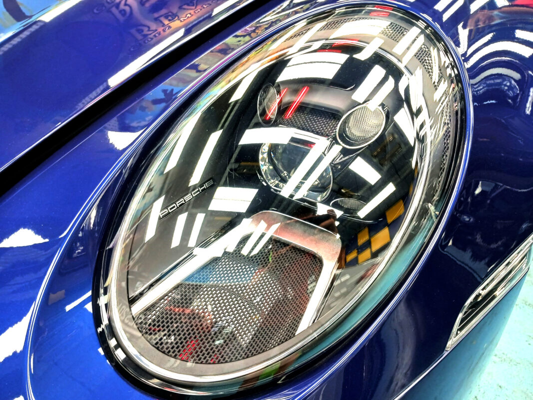 The 911 Carrera's coated paintwork holding clean reflections.
