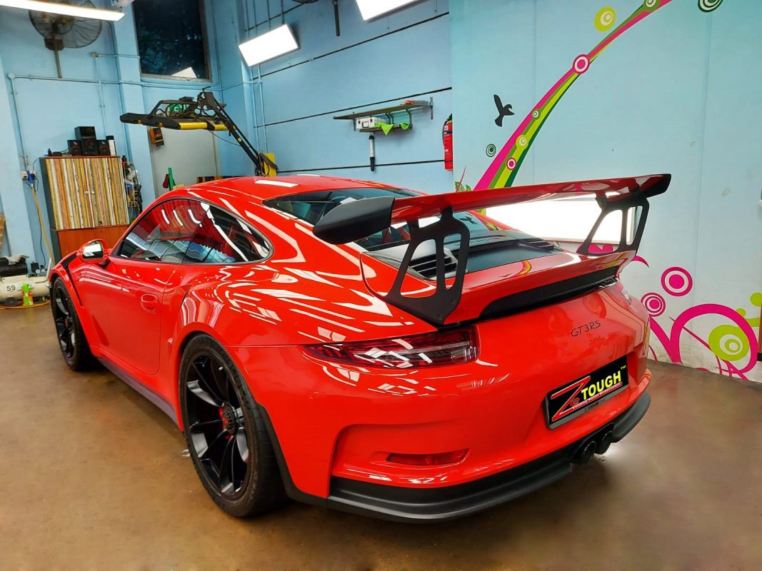 Rear quarter of the 911 GT3 RS, glossy and protected.