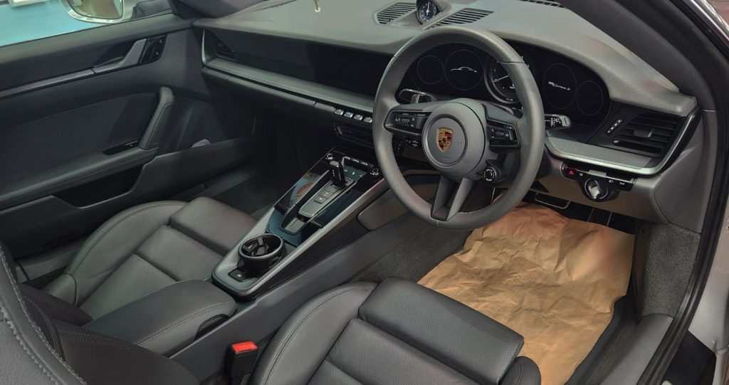 The 911 Panamera parked in the workshop, freshly coated.