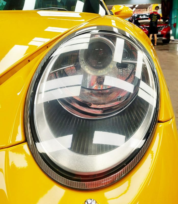 The 911 Targa's coated paintwork showing clean reflections.