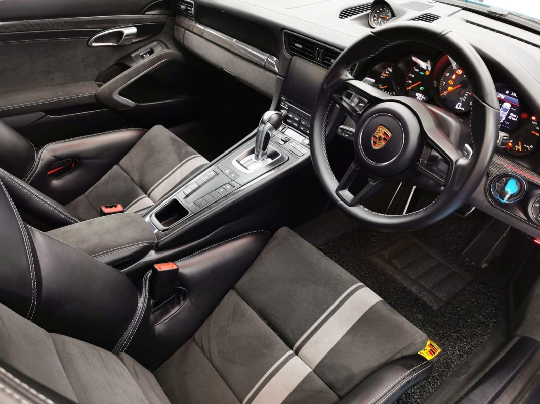 The 911's coated paintwork showing clean reflections.