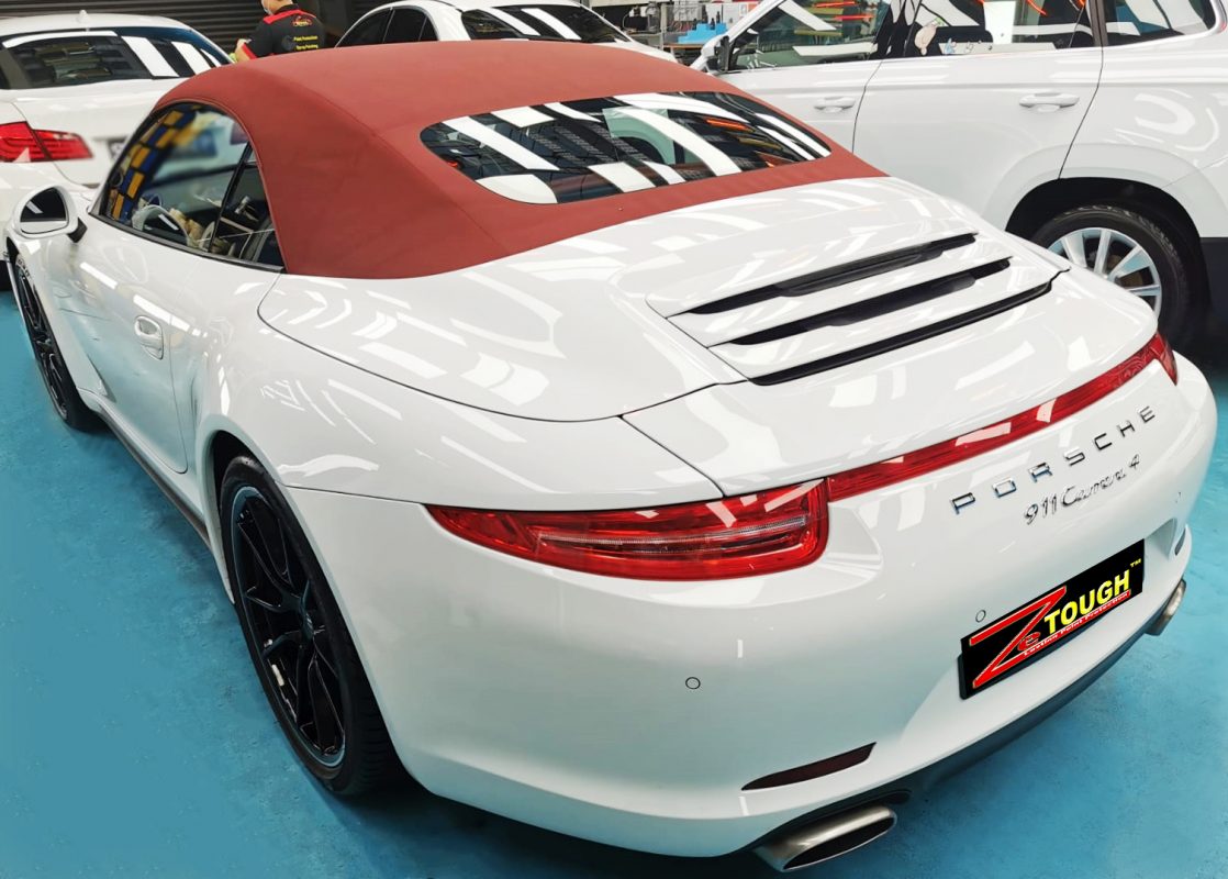 Rear quarter of the 911, glossy and protected.