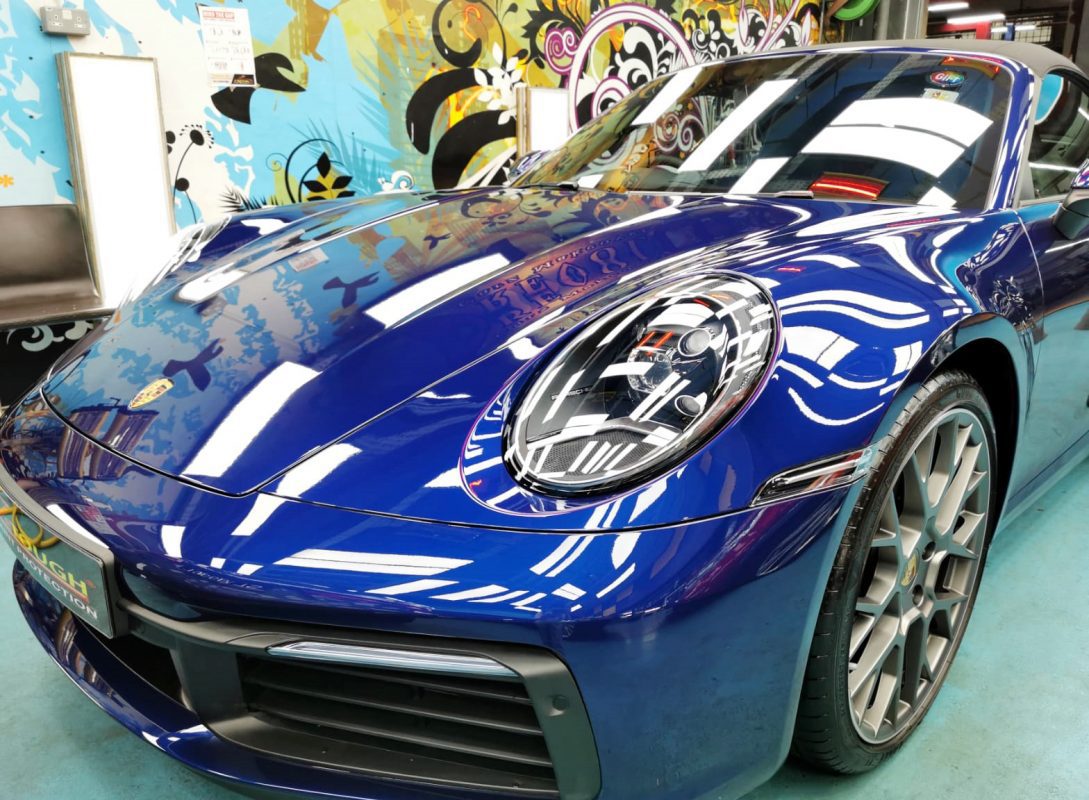 The Porsche 992 Cabriolet from a side angle after the ceramic coating.