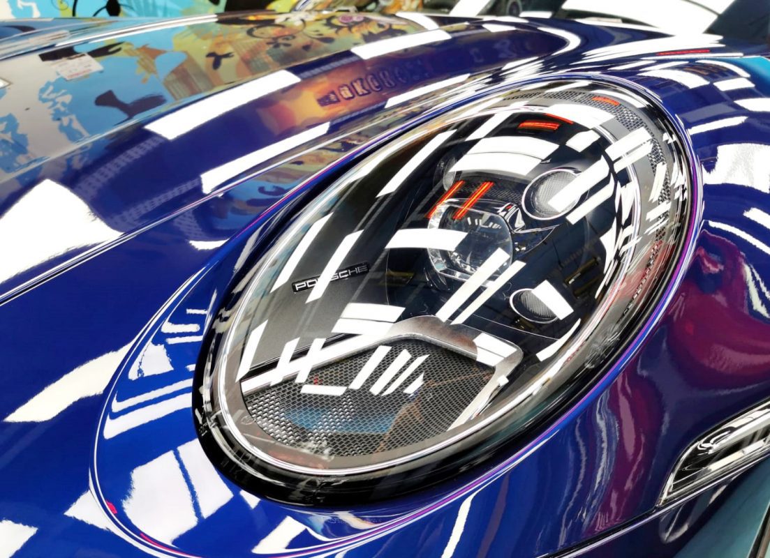 The 992 Cabriolet's coated paintwork showing clean reflections.