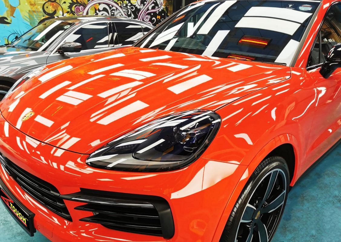 The Porsche Cayenne from a side angle after the ceramic coating.