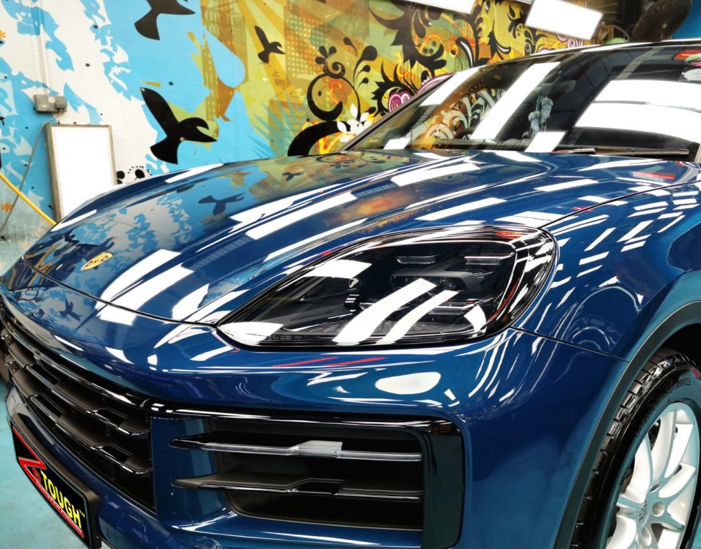 The Porsche Cayenne from a side angle after the ceramic coating.