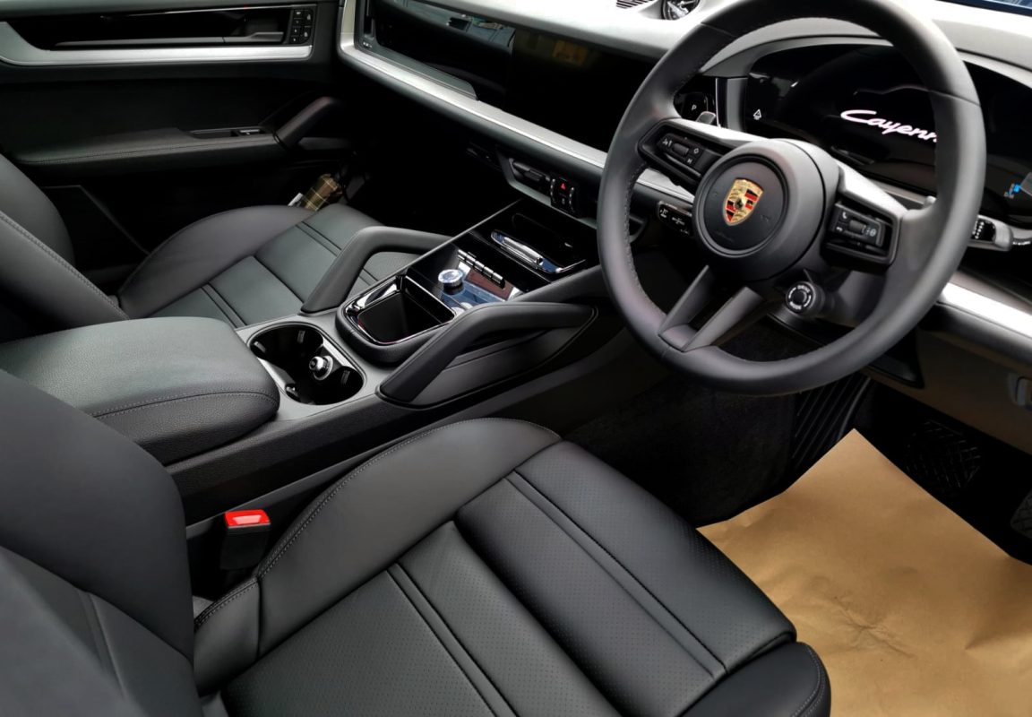 The Porsche Cayenne parked in the workshop, freshly coated.