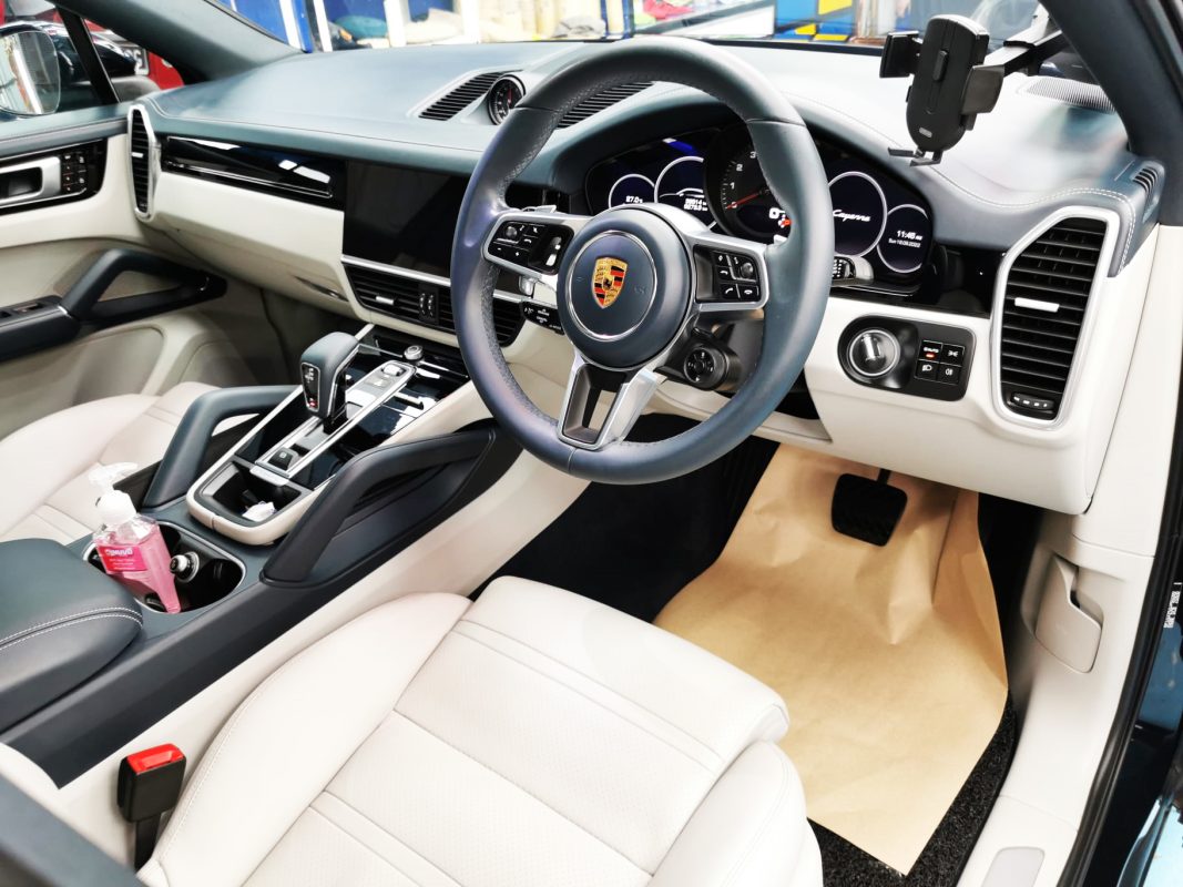 The Porsche Cayenne parked in the workshop, freshly coated.