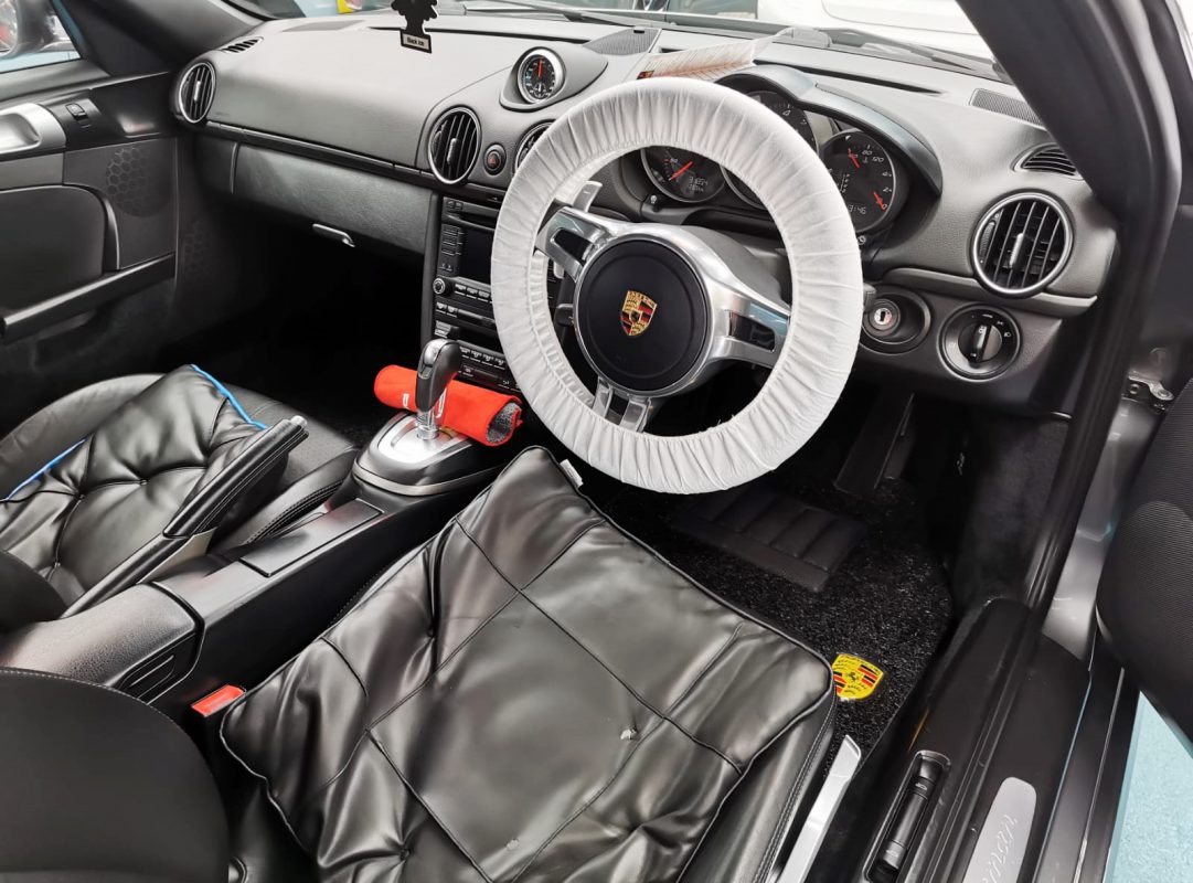 The Porsche Cayman in the workshop, freshly coated.