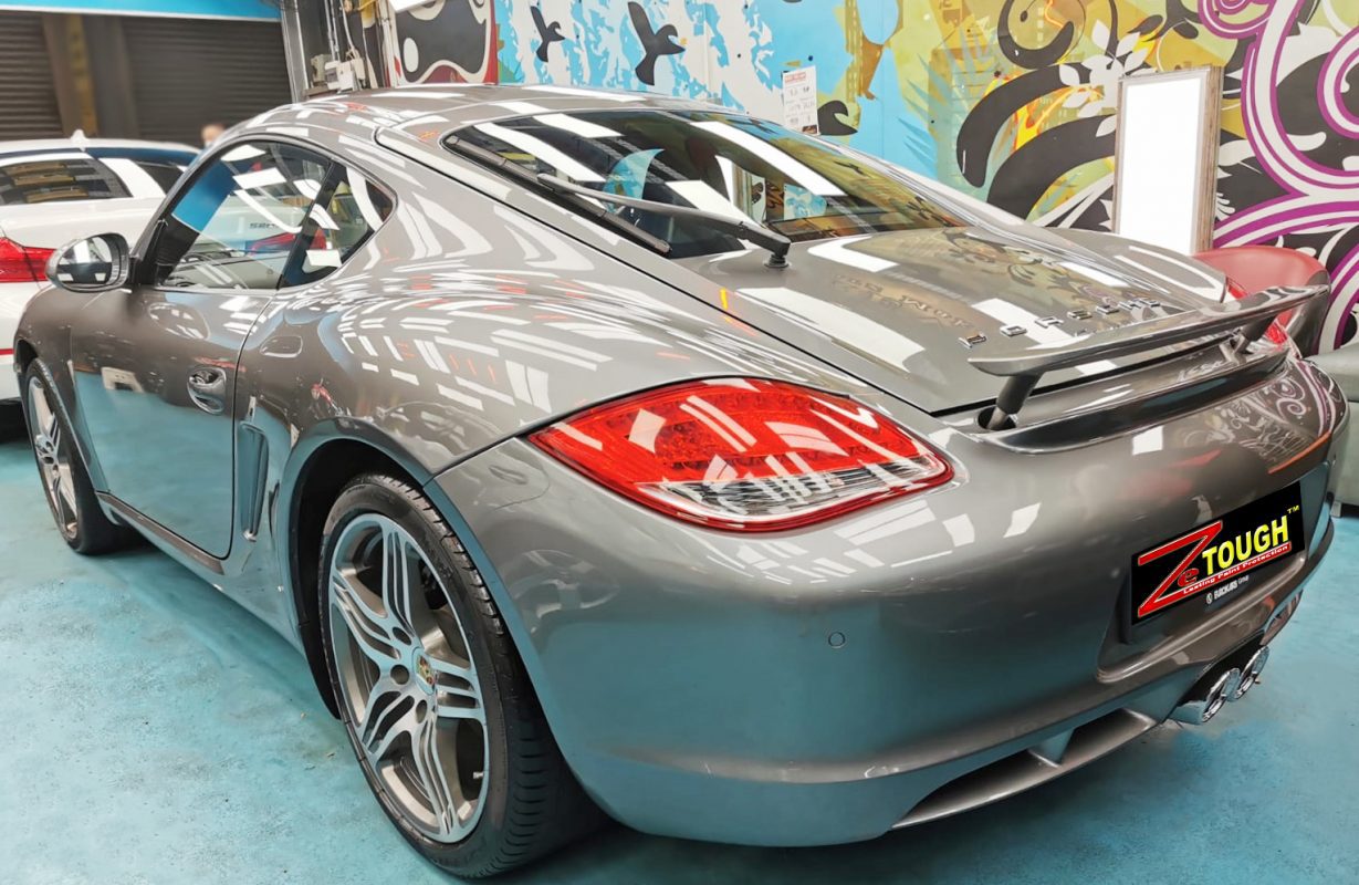 Rear quarter of the Cayman, glossy and protected.