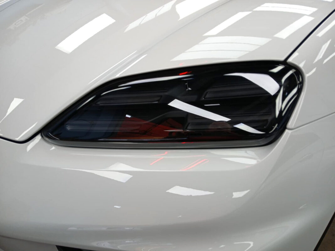 The Macan's coated paintwork showing clean reflections.