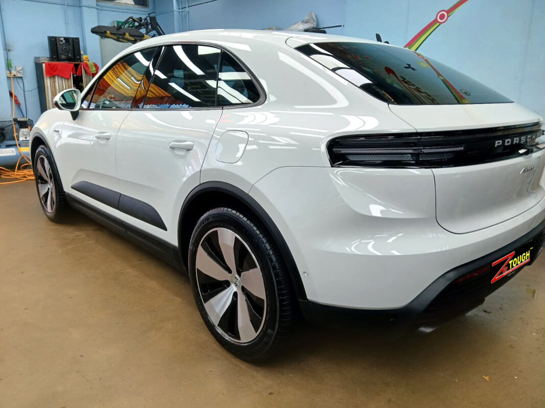 Rear quarter of the Porsche Macan, glossy and protected.