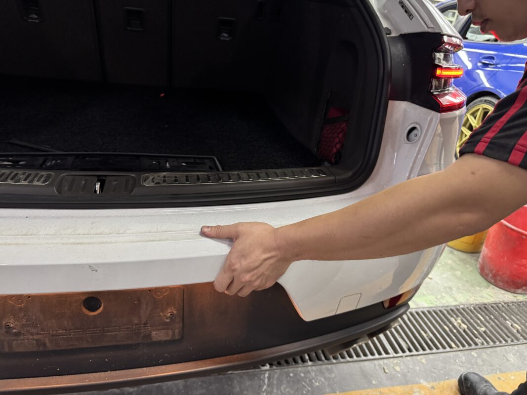 Components being dismantled from the Porsche Macan in preparation for spraying.