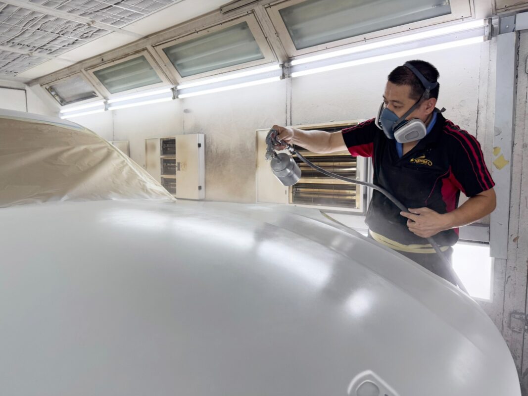 The Porsche Macan after spraying, being wet-sanded back.