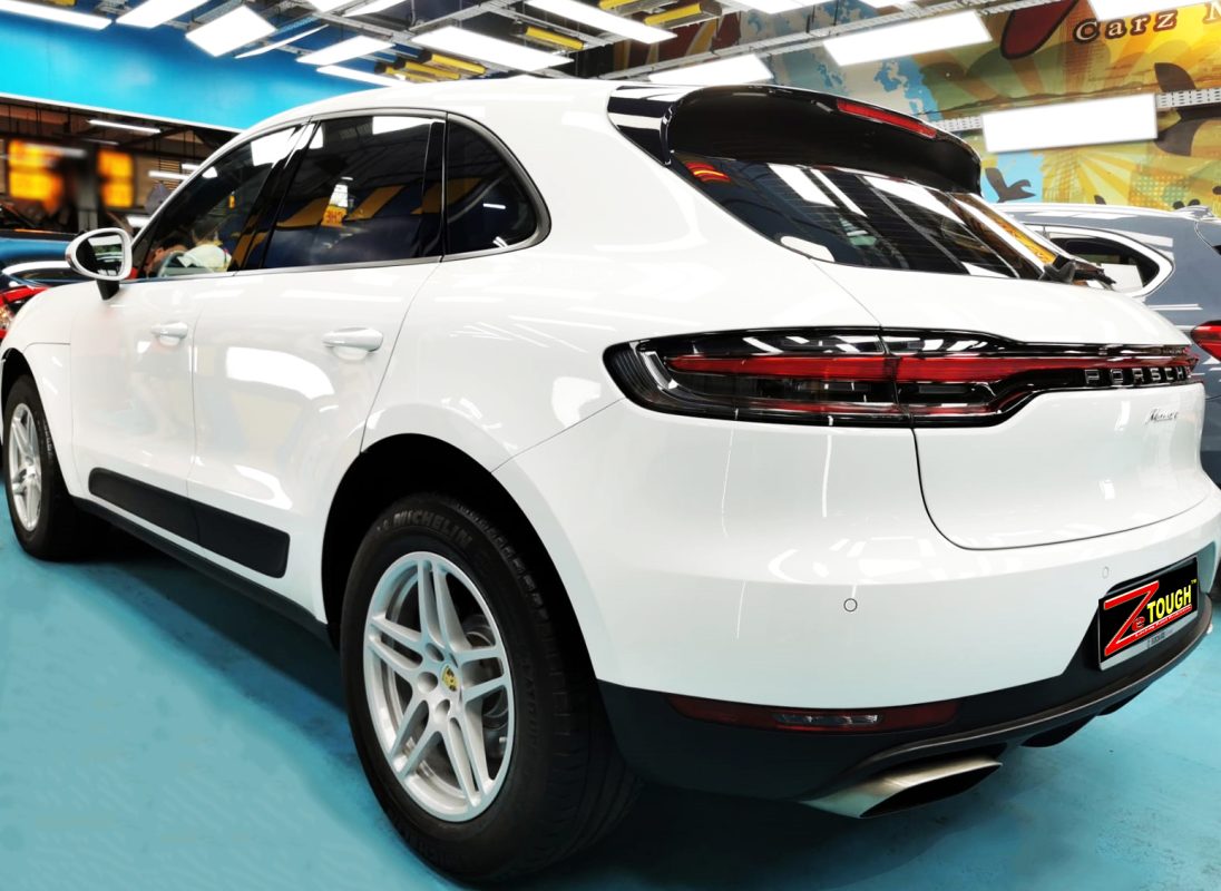 Rear quarter of the Macan II, glossy and protected.