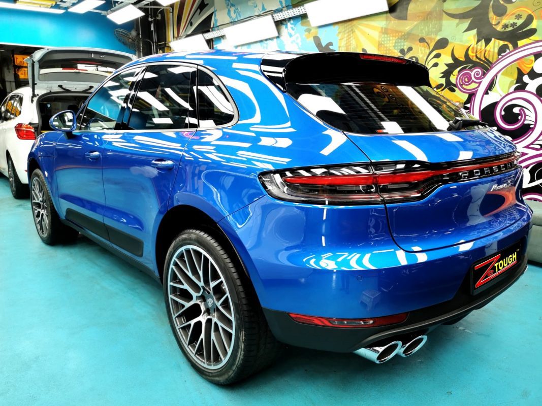 Rear quarter of the Macan S, glossy and protected.