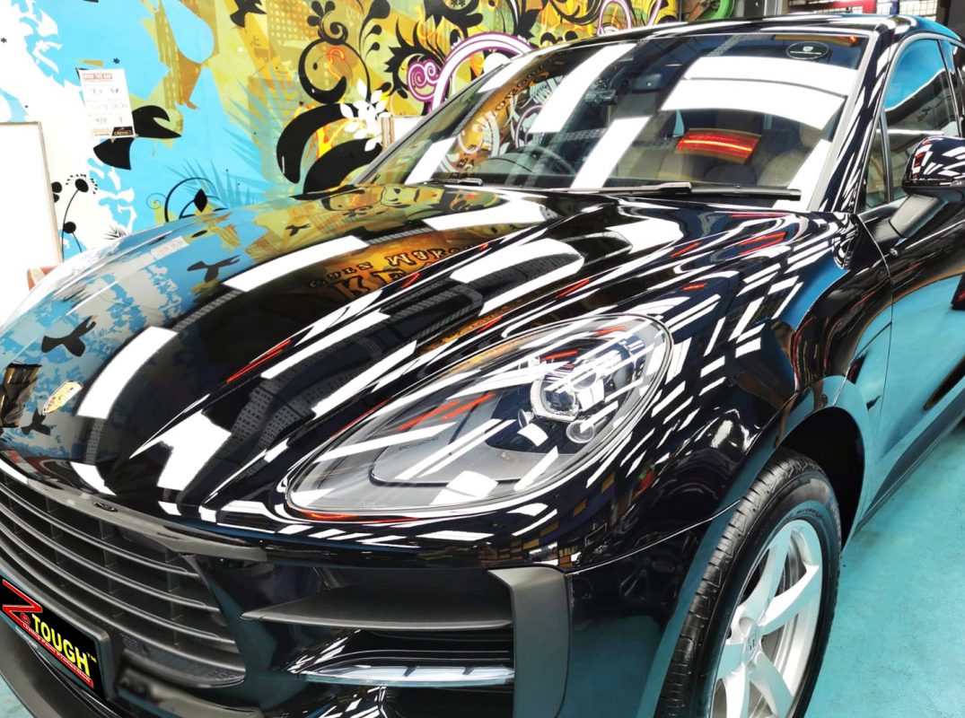 The Porsche Macan from a side angle after the ceramic coating.