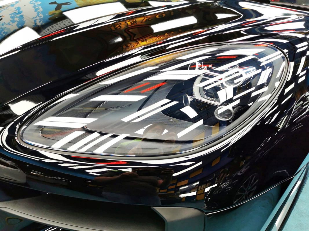 The Macan's coated paintwork showing clean reflections.