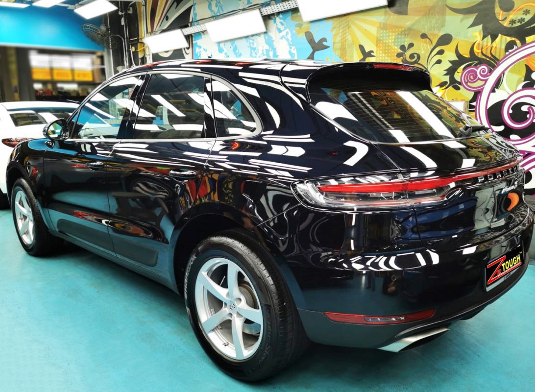 Rear quarter of the Porsche Macan, glossy and protected.