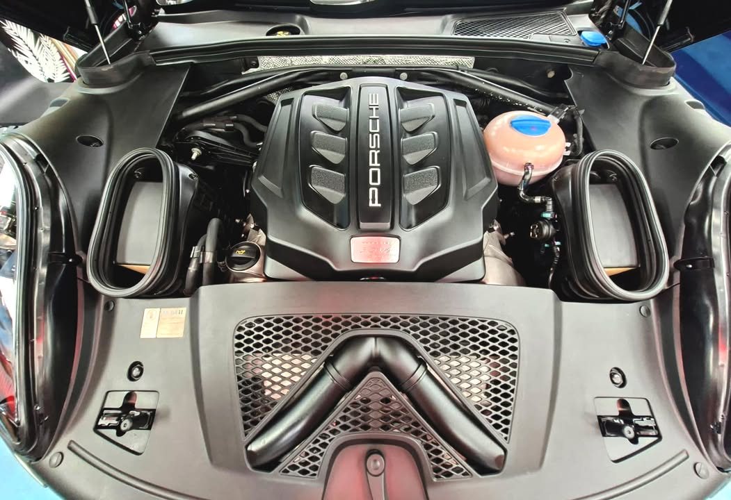 Porsche engine cover in the clean engine bay.