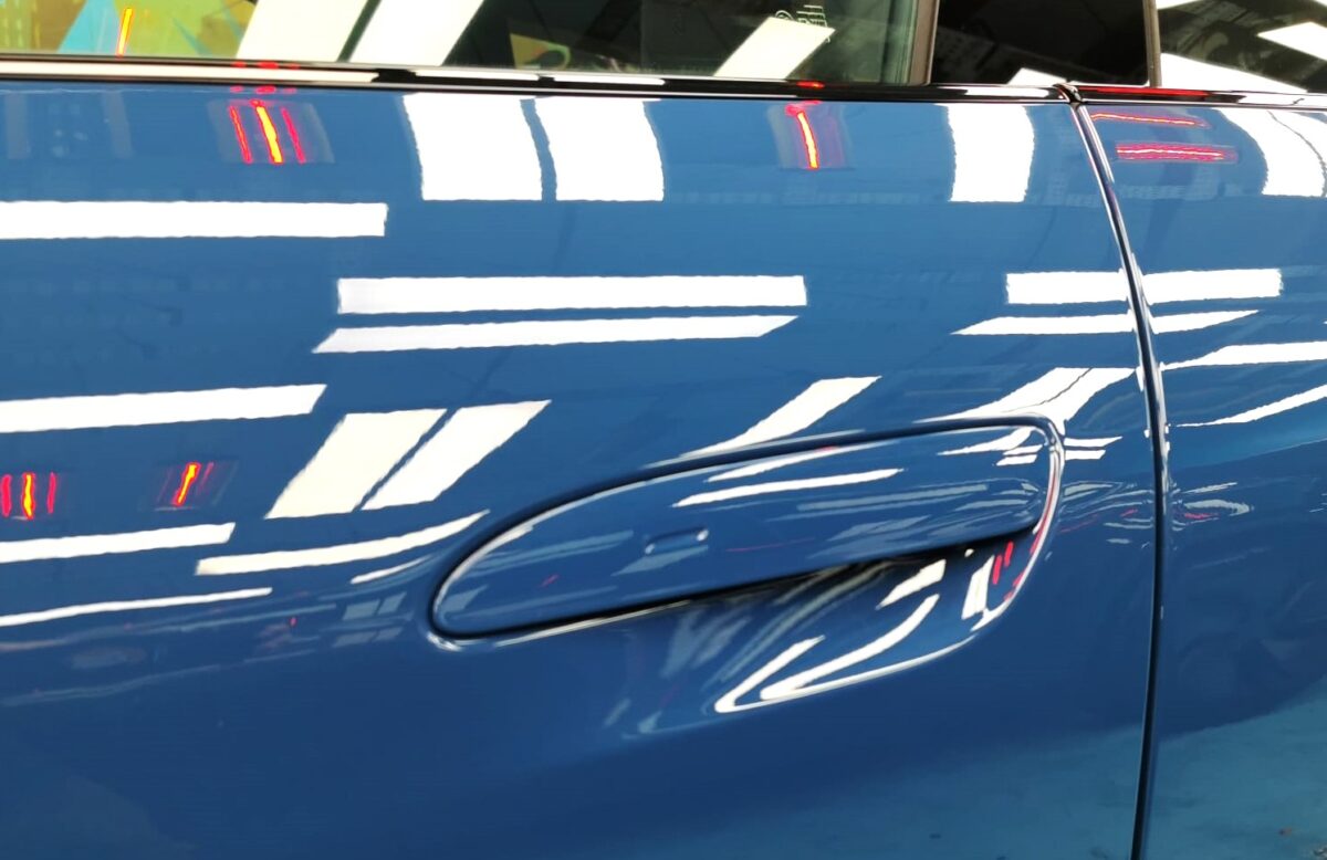 The coated paintwork of the Porsche Taycan, clean and sharp.
