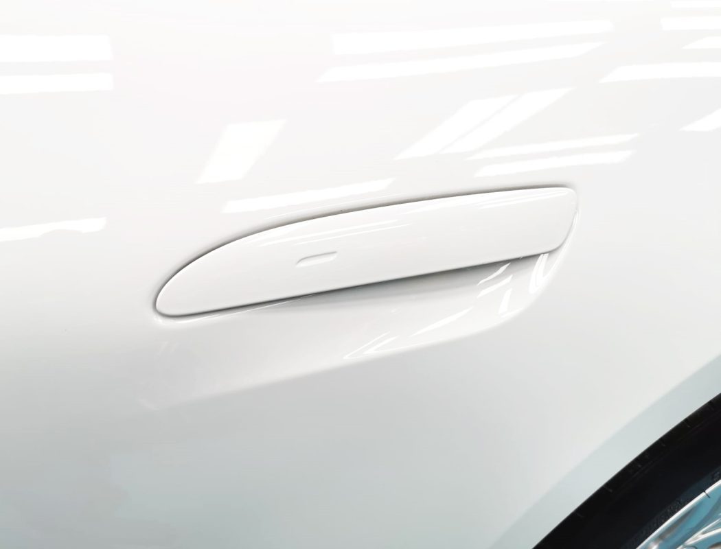 Front three-quarter view of the Porsche Taycan after coating.