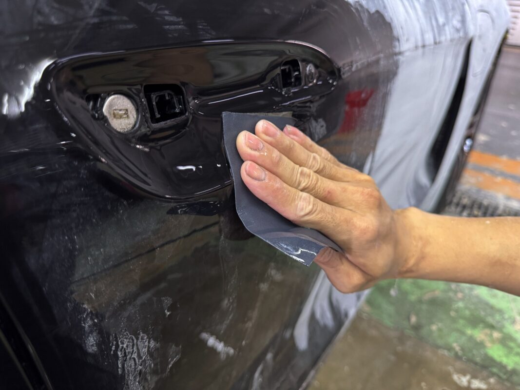 Bodywork on the Porsche Taycan in progress.