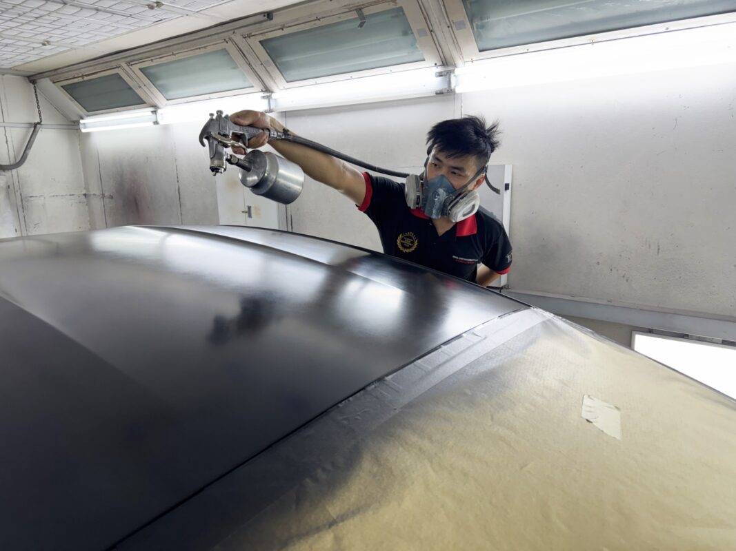 The Porsche Taycan during its paint repair.