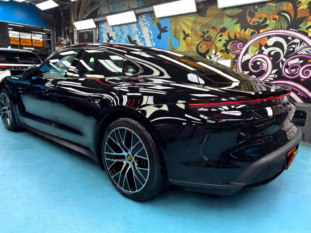 The finished Porsche Taycan, an even coat across every panel.