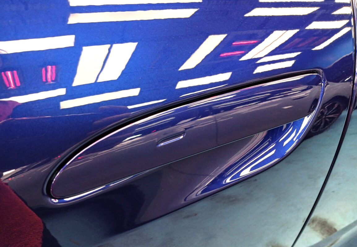 The Taycan II parked in the workshop, freshly coated.