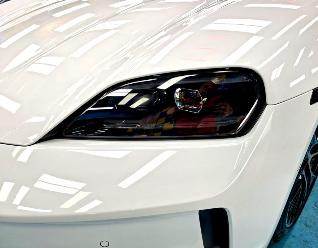 Glossy bodywork of the Porsche Taycan after coating.