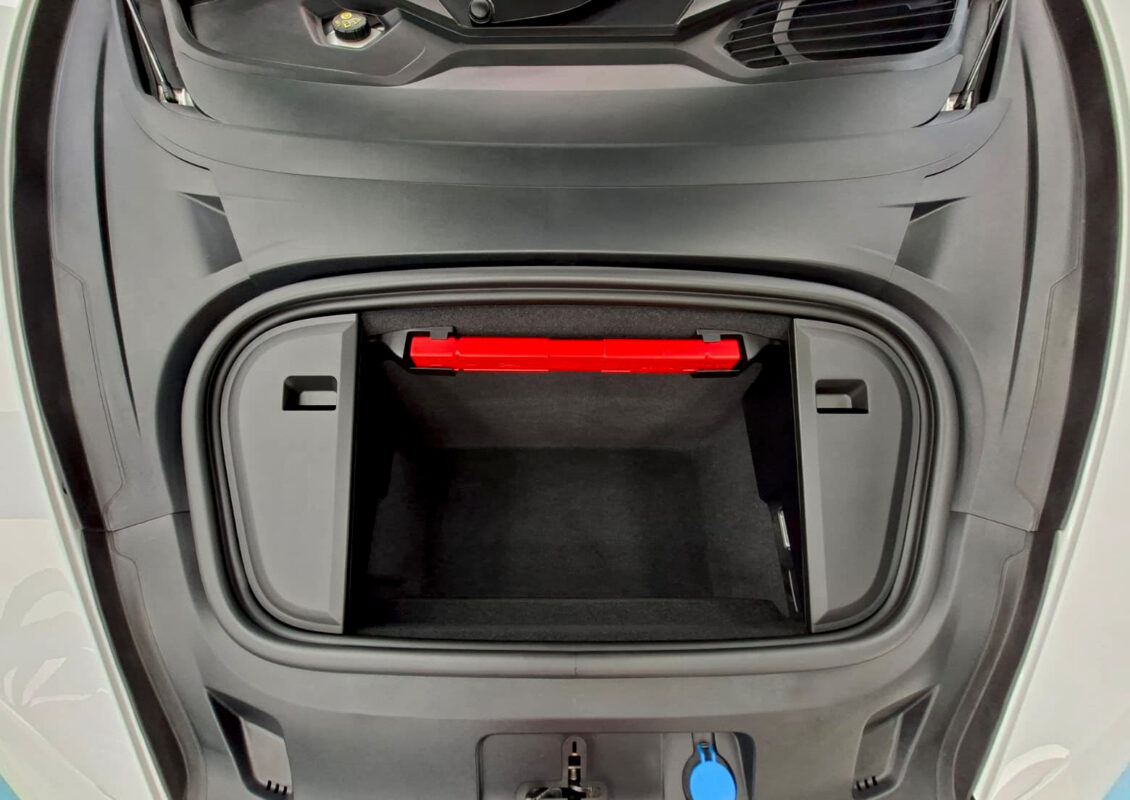 Reflections across the coated panels of the Porsche Taycan.