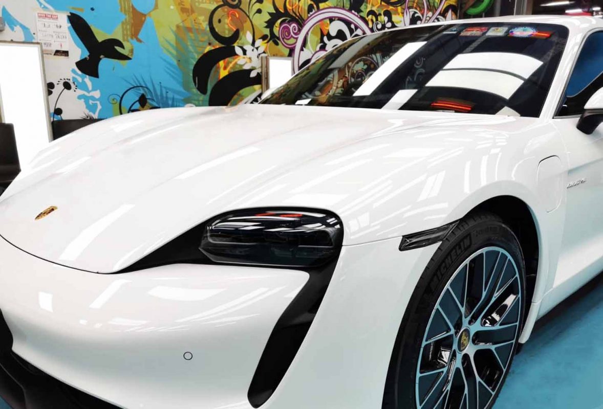 The Porsche Taycan from a side angle after the titanium coating.