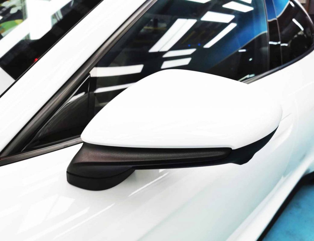 Side panel of the Porsche Taycan with the titanium finish locked in.