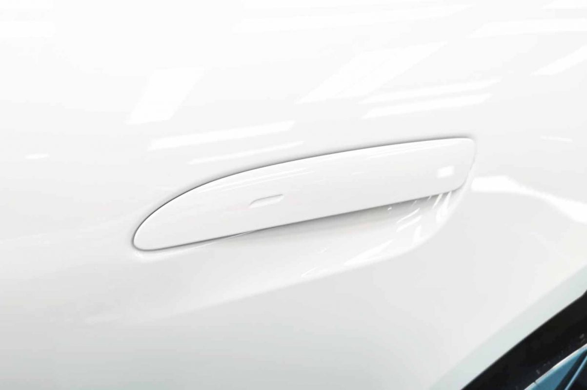 Front three-quarter view of the Porsche Taycan after coating.